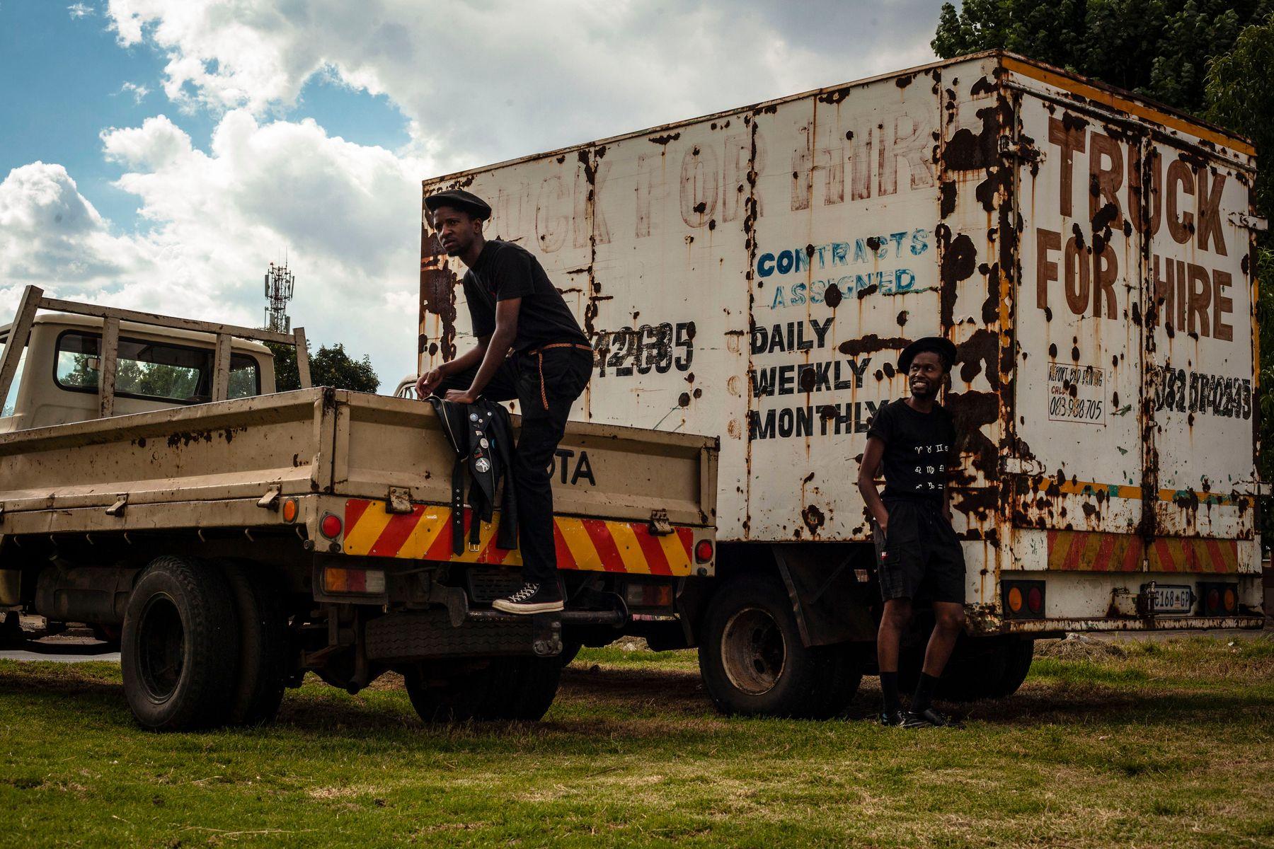 A load being arranged on a truck available for hire